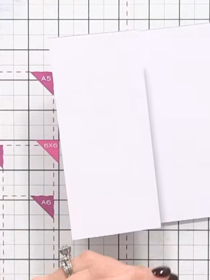 Step 3: Open the card flat and place it on your guillotine trimmer with the fold line visible.