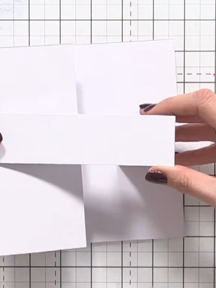 Step 6: Take the shorter piece and glue it to the inside front panel of the card, positioning it to create the stepped