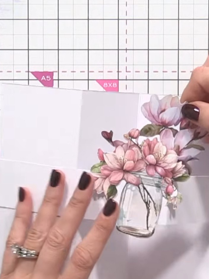 Step 7: Add decorative elements to the back panels of your card. Layer patterned card stock or embellishments onto the