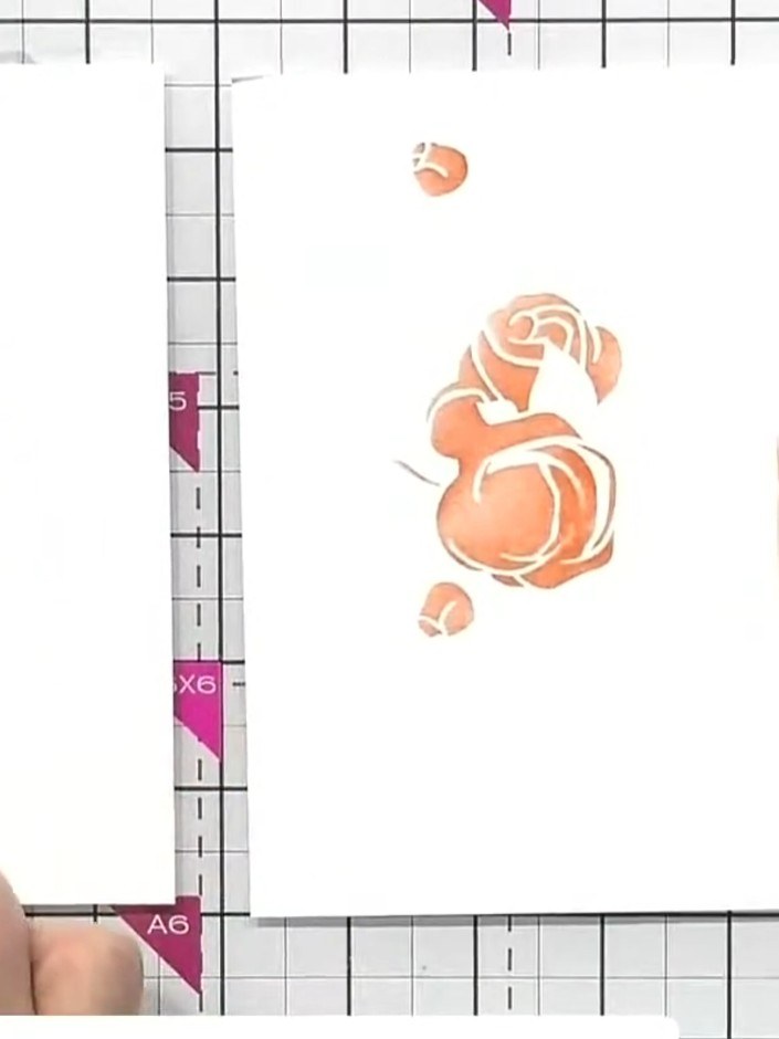 Step 8: Mount your completed rose panel onto a card base using adhesive. Position the panel centrally on the card fron