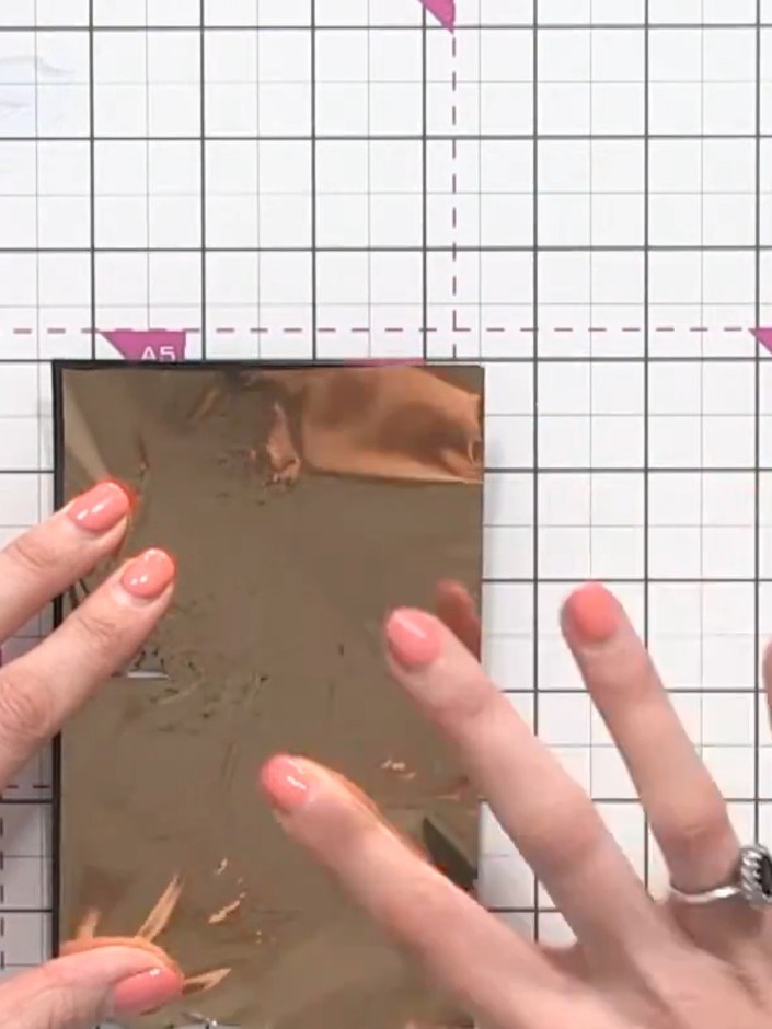 Step 7: Burnish the foil firmly over the design using your finger. Work carefully into all the detailed areas to ensur