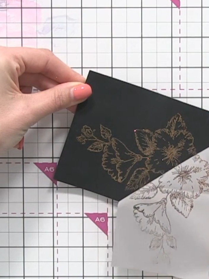 Step 8: Carefully peel back the foil sheet from the black card stock to reveal the foiled floral design underneath.