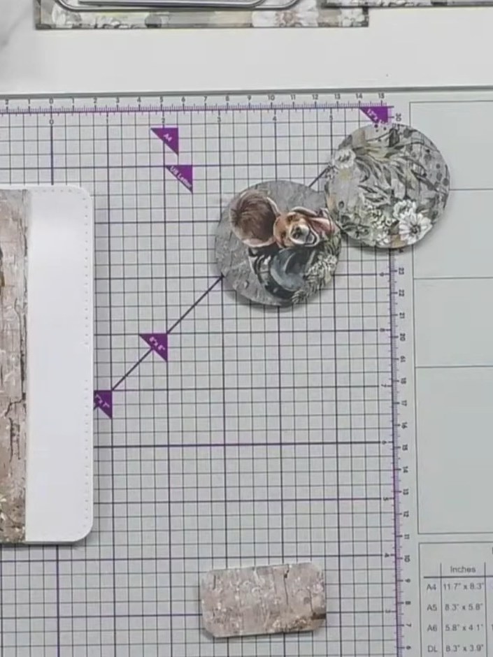 Step 9: Add decorative paper scraps down one side of the card base, positioning them to create visual interest whilst 