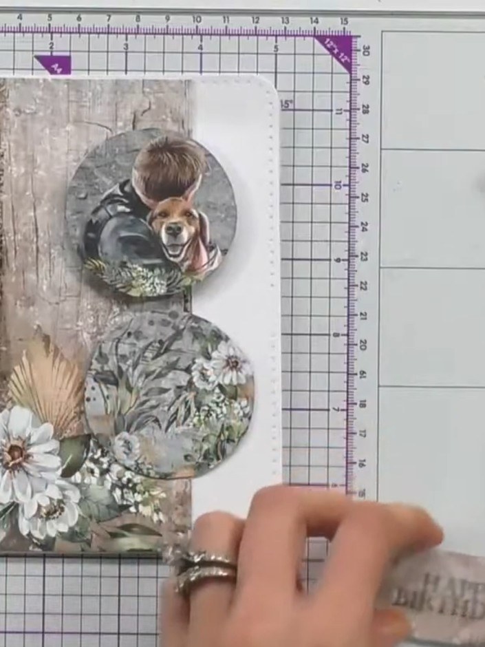 Step 7: Add a third circular element with floral and foliage design to the lower portion of the card for additional la