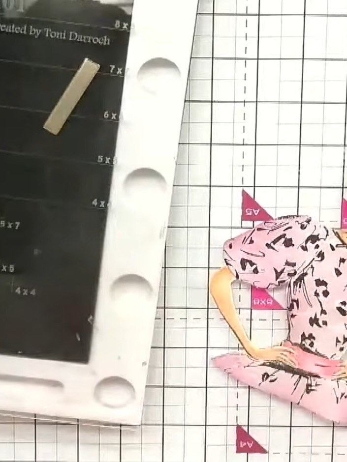 Step 9: Use a blending stump or brush with ink to soften the edges of the paper-pieced dolly, creating a subtle shadow