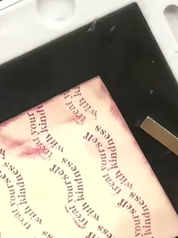 Step 10: Mount the stamped and coloured couple image onto the watercoloured background using a tape runner or glue. Pos