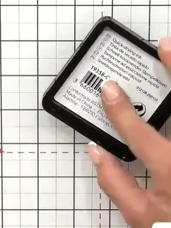 Step 6: Stamp a sentiment such as 'Treat yourself with kindness' onto the inked acrylic block using black ink.