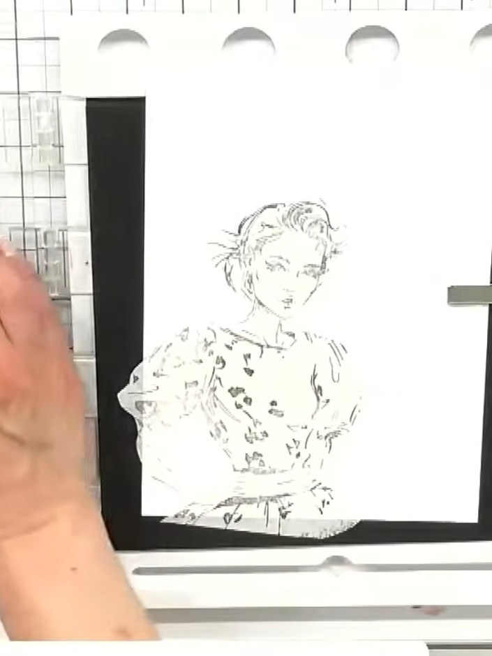Step 6: Stamp the Still Fabulous character onto white cardstock and position it within the masked area of the street s
