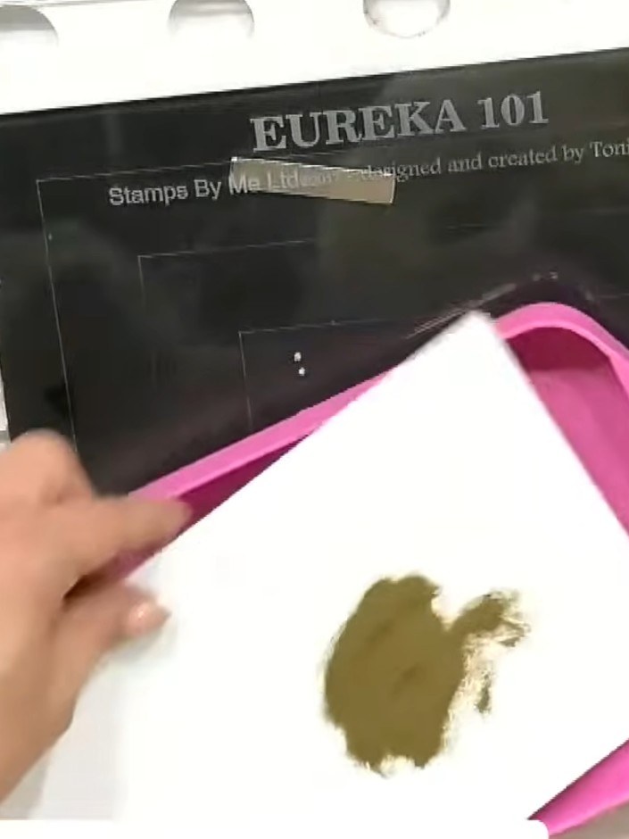 Step 3: Press white card stock onto the wet inked block to transfer the green watercoloured background. Ensure even pr