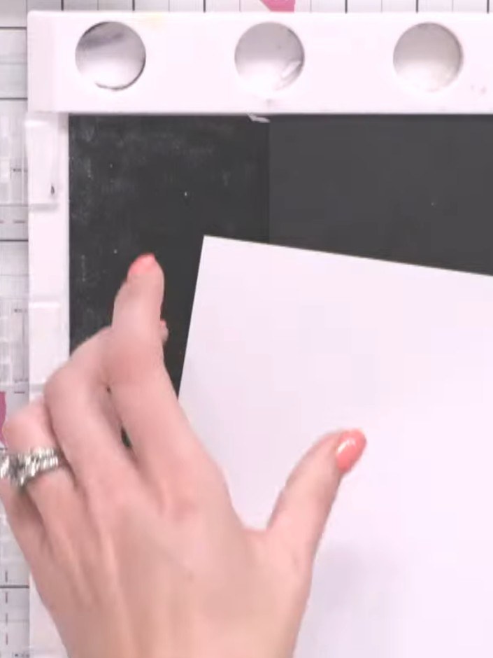 Step 3: Score a horizontal line across the patterned paper piece to create a fold line for the pocket at the top of th