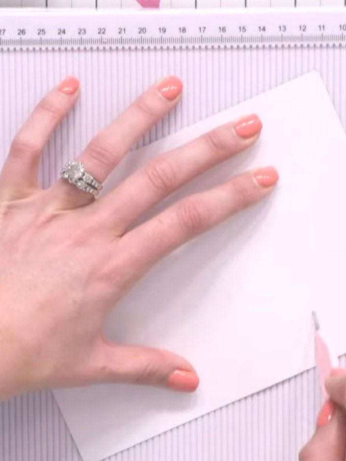 Step 4: Fold the patterned paper back along the score line to create a pocket effect at the top of the card.