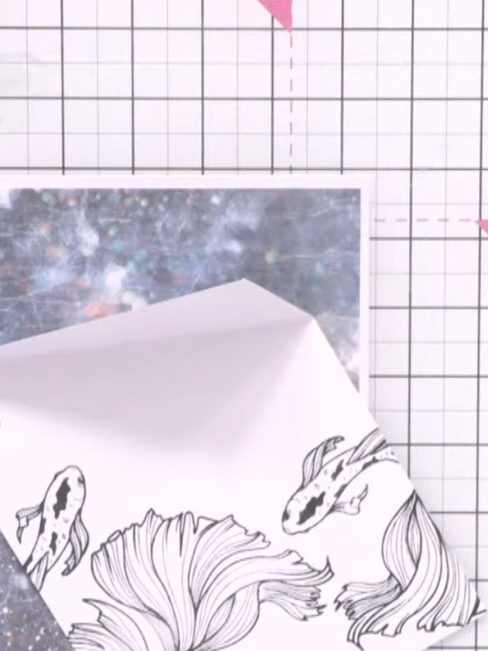 Step 6: Adhere the first piece of patterned paper flat to your card base. Layer the folded pocket piece on top using f