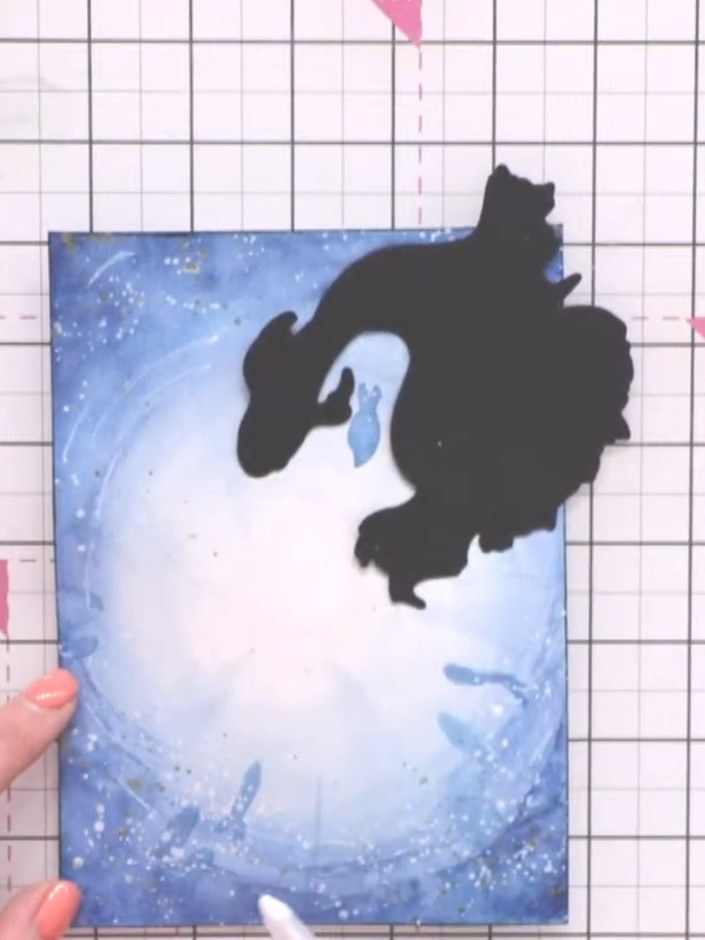 Step 12: Use a white gel pen to add fine lines through the water areas to create movement and detail. Position washi ta