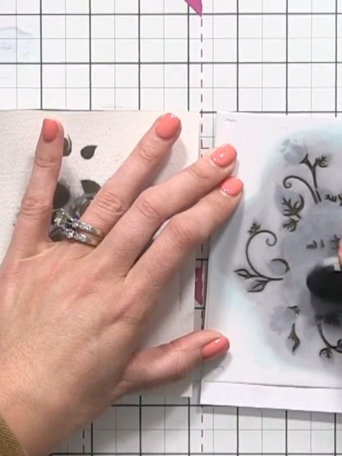 Step 10: Using a black stamping ink pad, carefully dab over the final stencilled layer to add definition and bring out 
