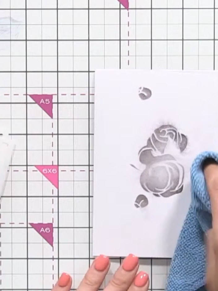 Step 5: Use a tissue to blot away any excess water from the stamped image. Allow the ink to dry slightly before procee