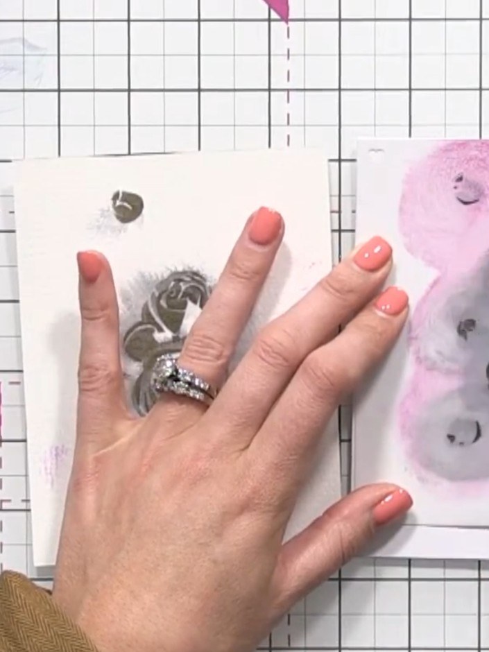 Step 7: Apply stencil number three over your card. Press the black ink pad firmly through the stencil to transfer the 