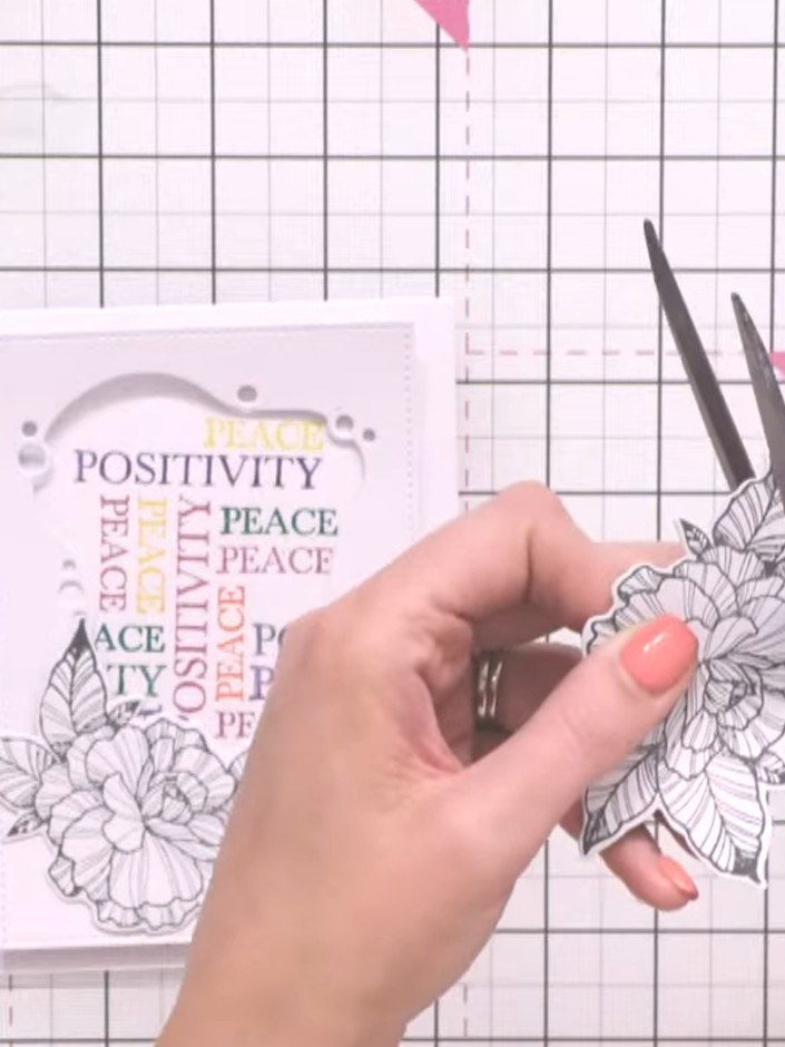 Step 11: Using scissors, carefully cut away the leaves from one of the stamped flower images, leaving just the flower h