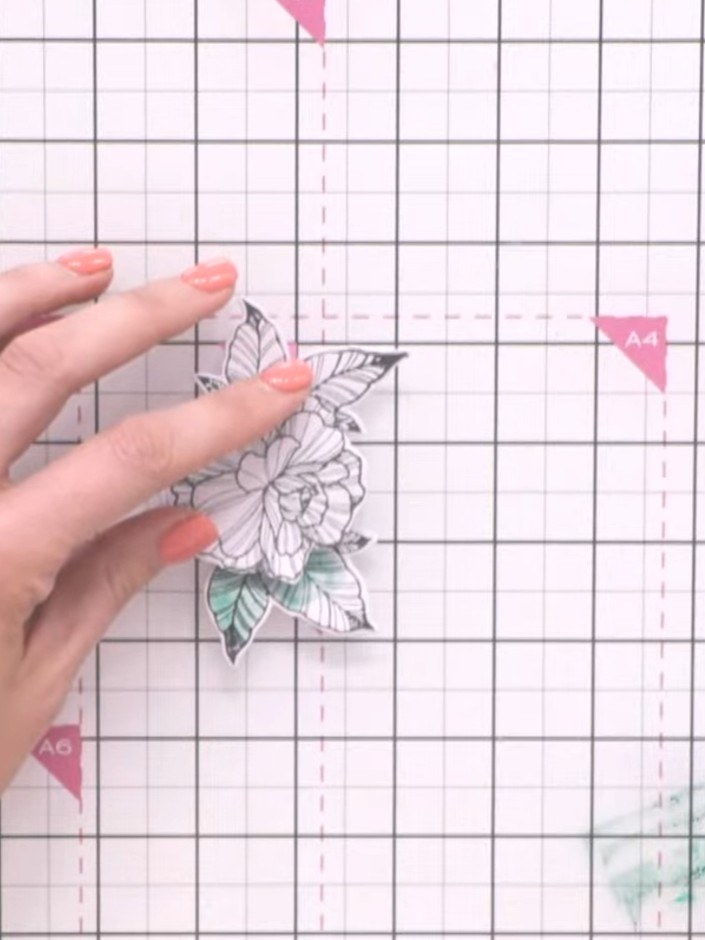 Step 12: Paint the leaves of the remaining flower green using watercolour or diluted ink. Add darker green shading from