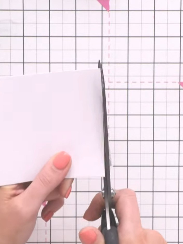Step 2: Trim the pale pink card stock to fit underneath the frame aperture, ensuring it sits neatly behind the opening