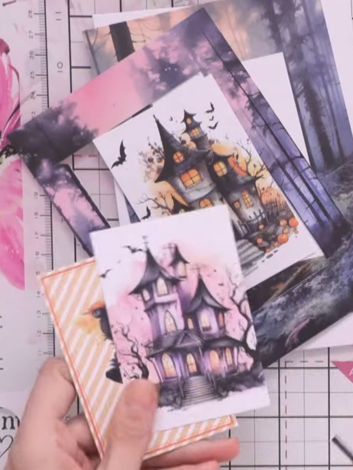 Step 5: Fussy cut the house character from the kit papers, carefully cutting around the outline of the haunted house i