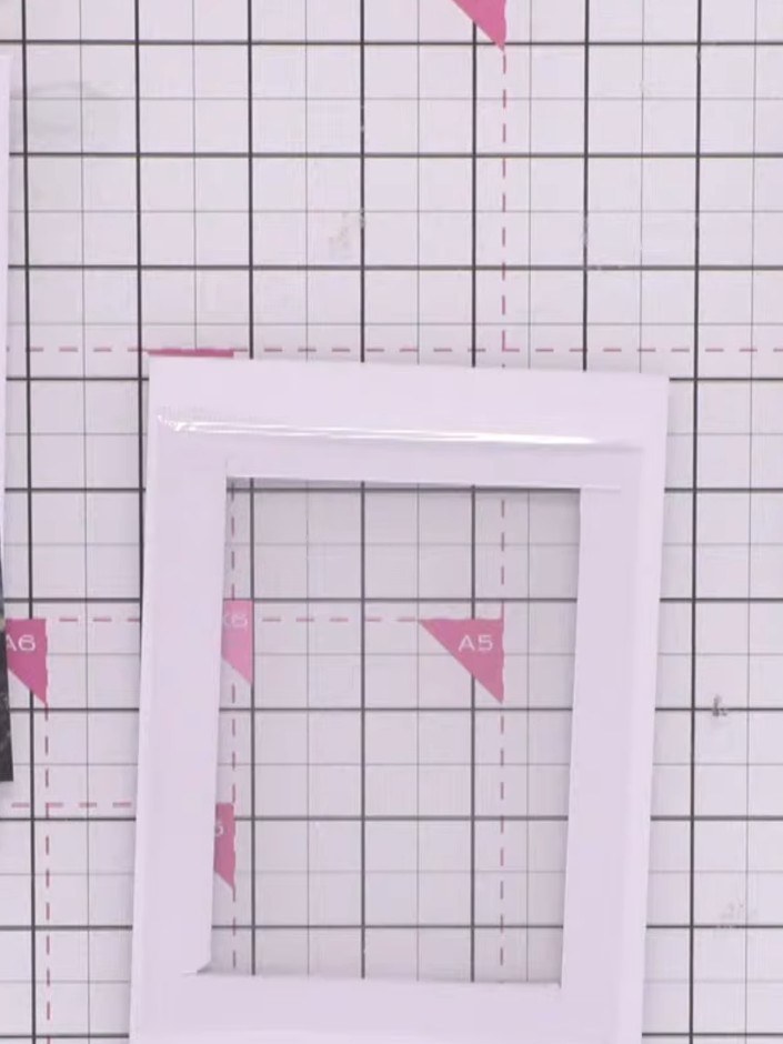 Step 8: Apply double-sided tape or foam pads all the way around the back of your card window frame, ensuring there are