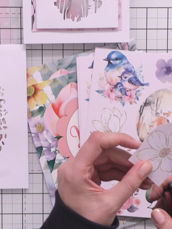 Step 1: Place the rose branch layering stencil onto your card base or background paper. Position it where you want the