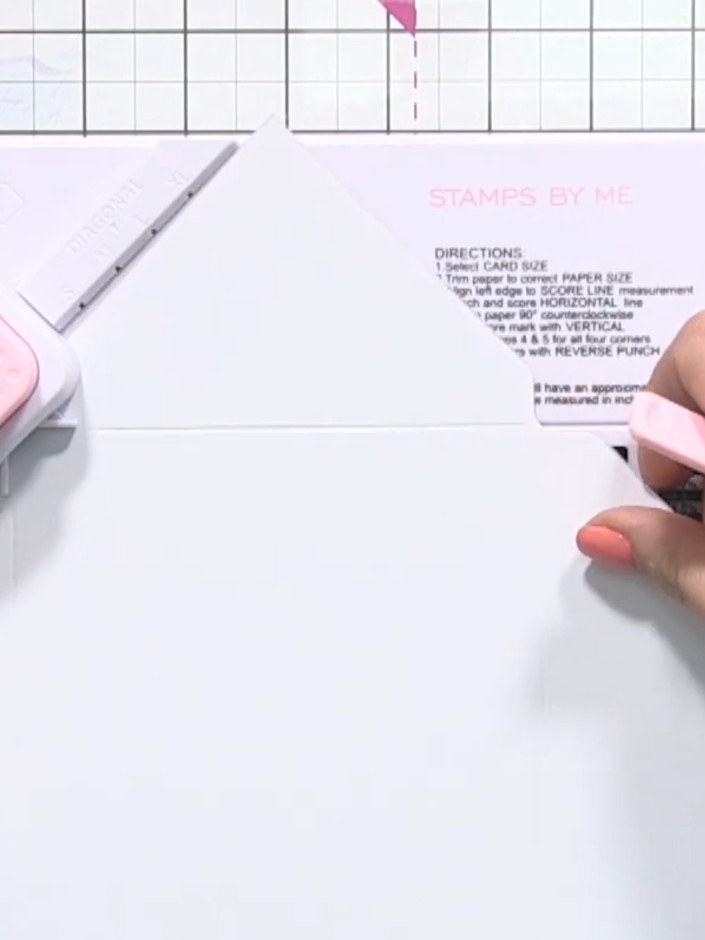 Step 6: Score and punch across the opposite side. Rotate the paper 90 degrees, align the twist line with the score lin