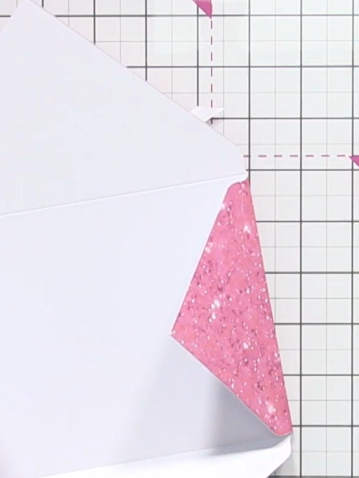 Step 7: Fold the envelope together along all the scored lines, creating crisp creases to form the envelope shape.