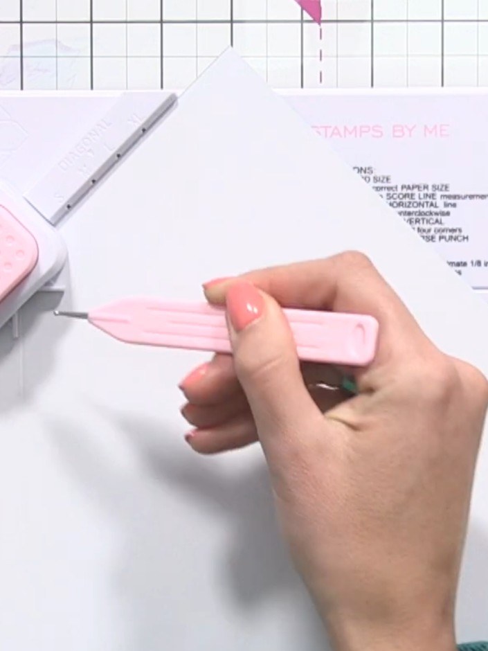 Step 2: Place your card stock into the Box and Envelope Maker, aligning it at the 4½ inch score line marking. Hold the