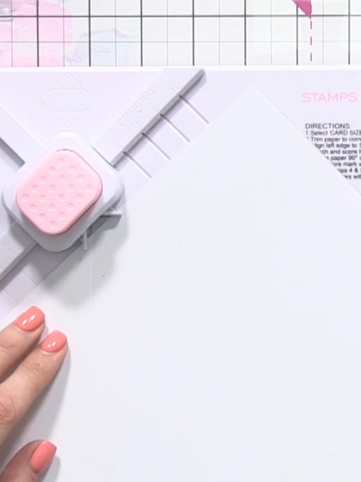 Step 5: Twist the paper and match the first score line back up with the alignment mark on the envelope maker board.