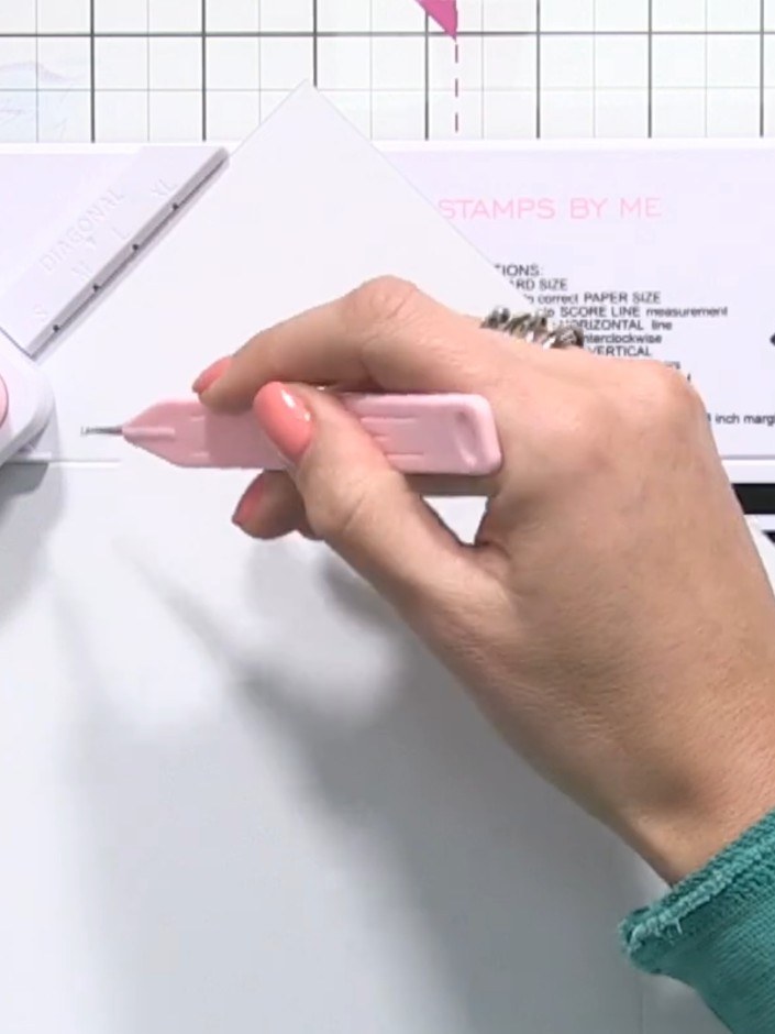 Step 7: Repeat the twist and punch process for the remaining two sides, ensuring the score lines match up correctly on