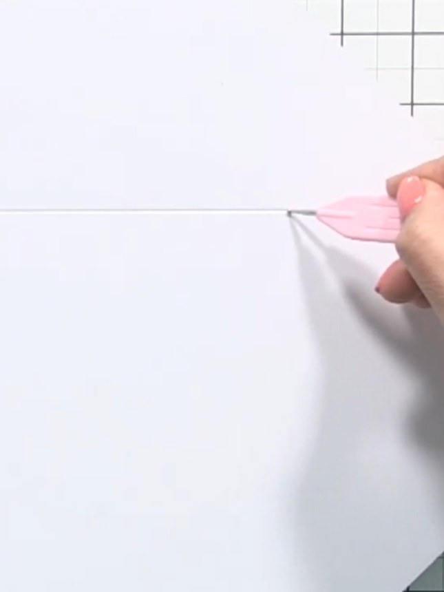 Step 4: Twist the paper to align with the next XL line on the envelope maker. Punch and score down and across.