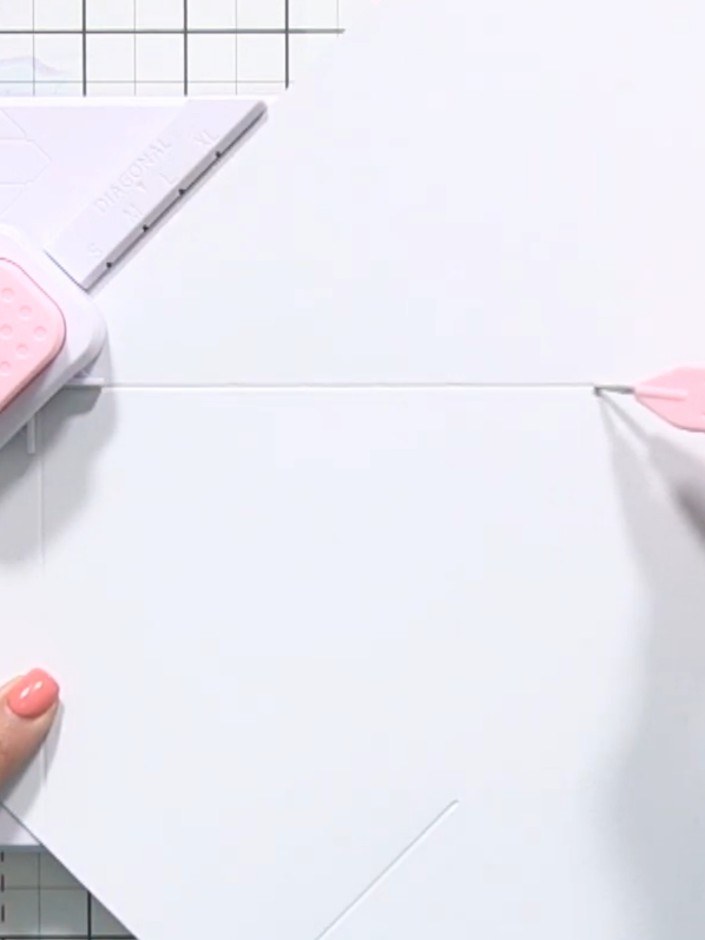 Step 5: Continue this pattern, rotating the paper and repositioning it in the envelope maker to punch and score along 