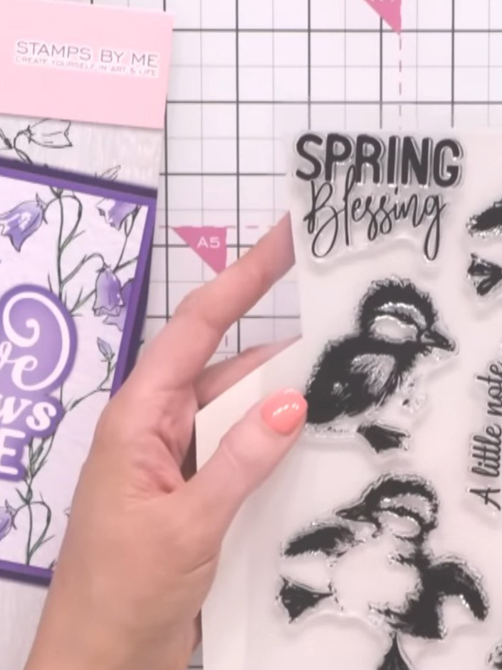 Step 8: Add a sentiment stamp such as 'Create Adventures for Yourself' below your watercoloured floral design to compl