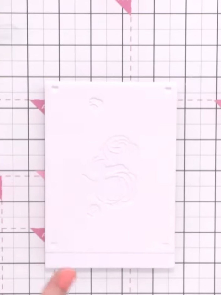 Step 2: Take stencil number one and position it at the top of your card blank. Use the etched numbers on the stencil a