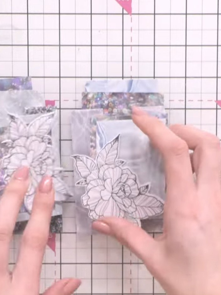 Step 10: Adhere the flower designs to the front of the wallet using PVA glue or foam pads for a 3D effect. Position the