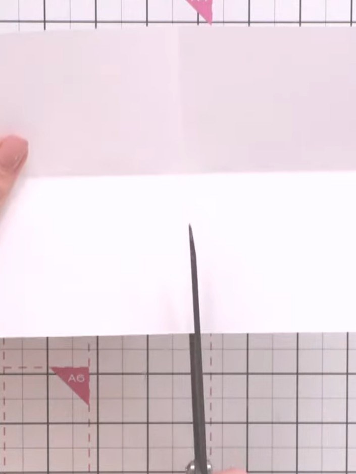 Step 3: Turn the paper landscape orientation (long way horizontal). Cut from the bottom of the score line up to the mi