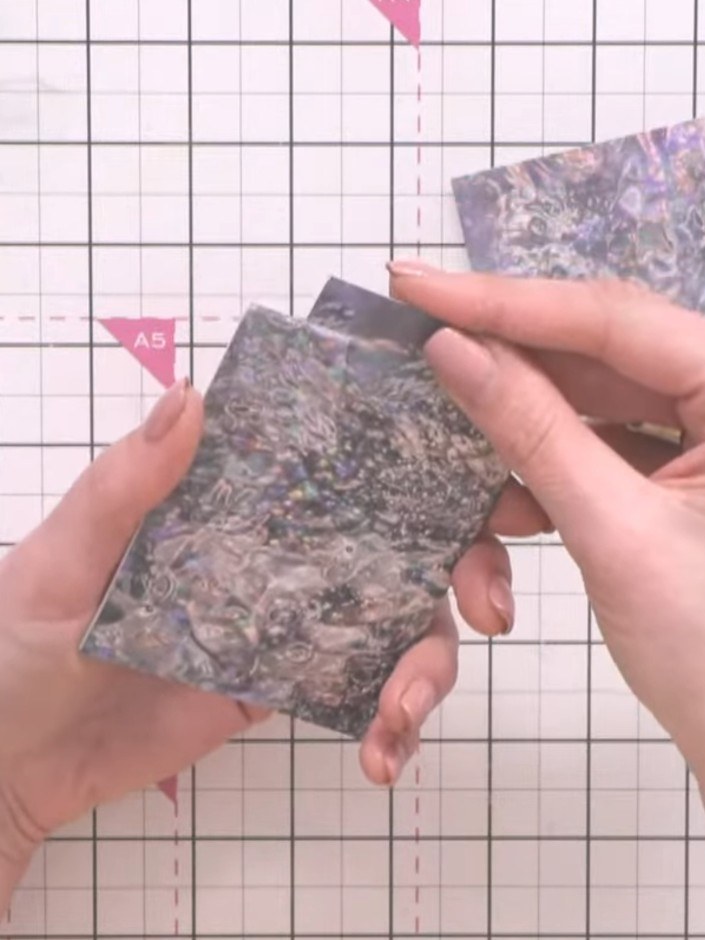 Step 6: Cut the decorative patterned paper into strips to create tags. These tags will slot into the top opening of th