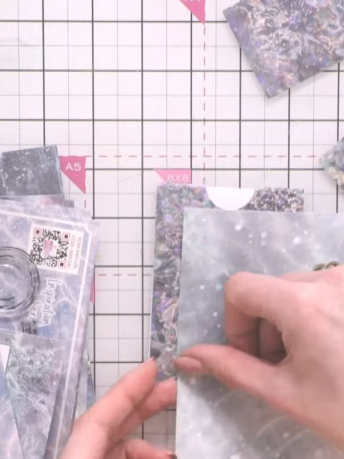 Step 7: Layer additional decorative paper panels inside the pockets for visual interest and contrast. Use papers from 