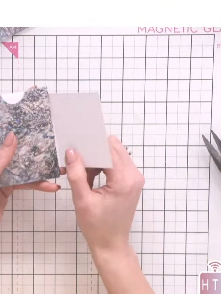 Step 8: Stamp the flower design from the stamp set onto white paper using dye ink. Position the stamp carefully and pr