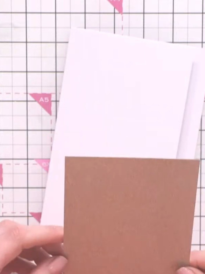 Step 2: Mount the gold-brown cardstock panel to the left edge of the white card base, leaving the right side exposed t