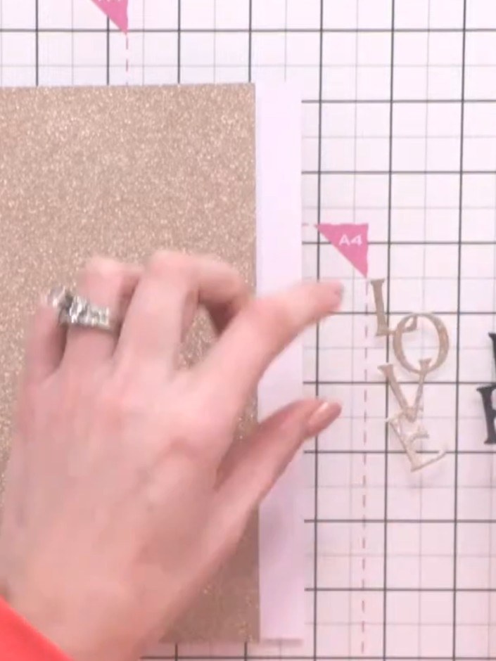 Step 3: Cut the word 'love' from both black and gold cardstock to create a layered sentiment with a drop shadow effect