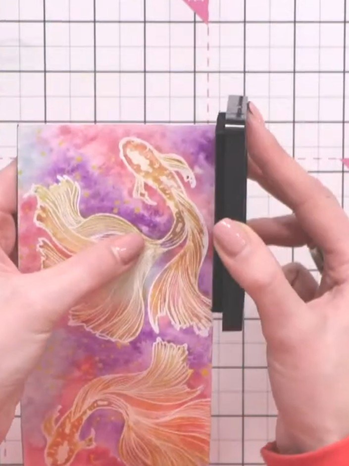 Step 5: Edge the card with a black ink pad by tilting it slightly and dragging it down the sides to frame the design.