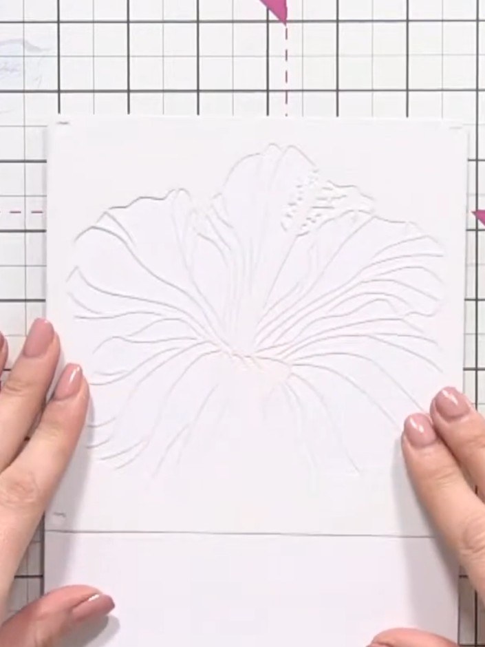 Step 2: Position stencil number one on your card. Tap off excess yellow ink from your brush, then apply it through the