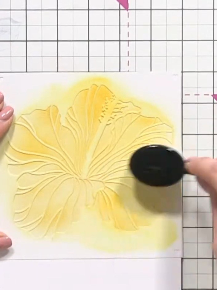 Step 4: Apply orange ink to stencil number two using a blending brush. Start from the centre of the flower and work ou