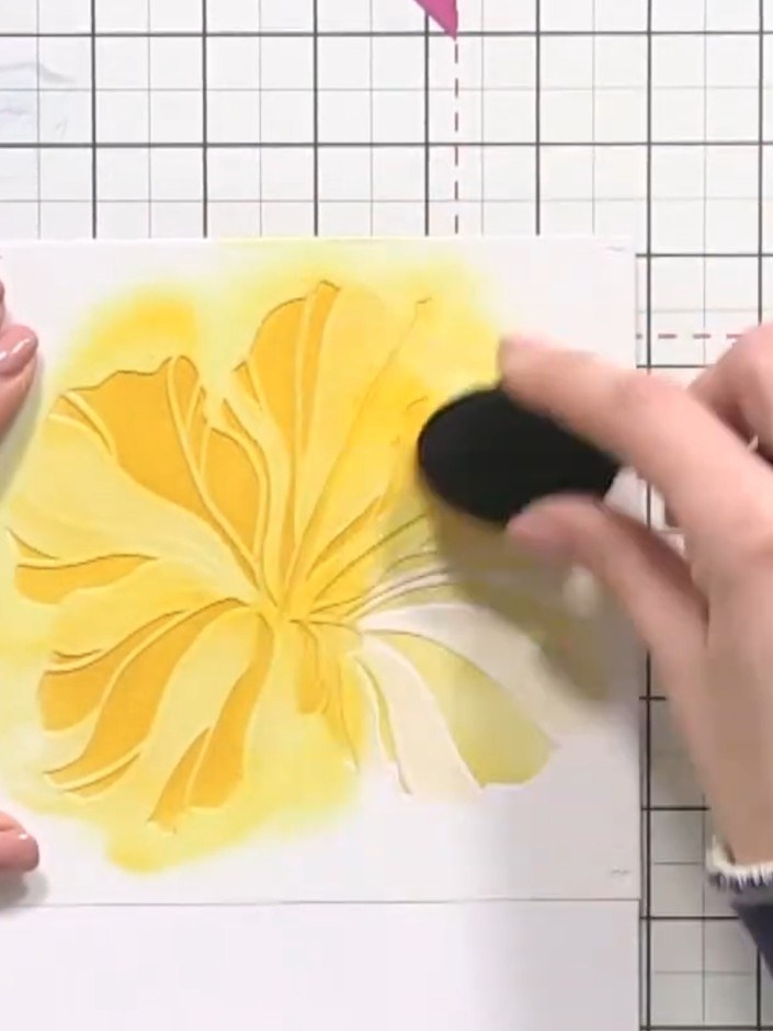 Step 5: Place stencil number three over the flower and apply yellow ink using a blending brush. Press firmly to build 