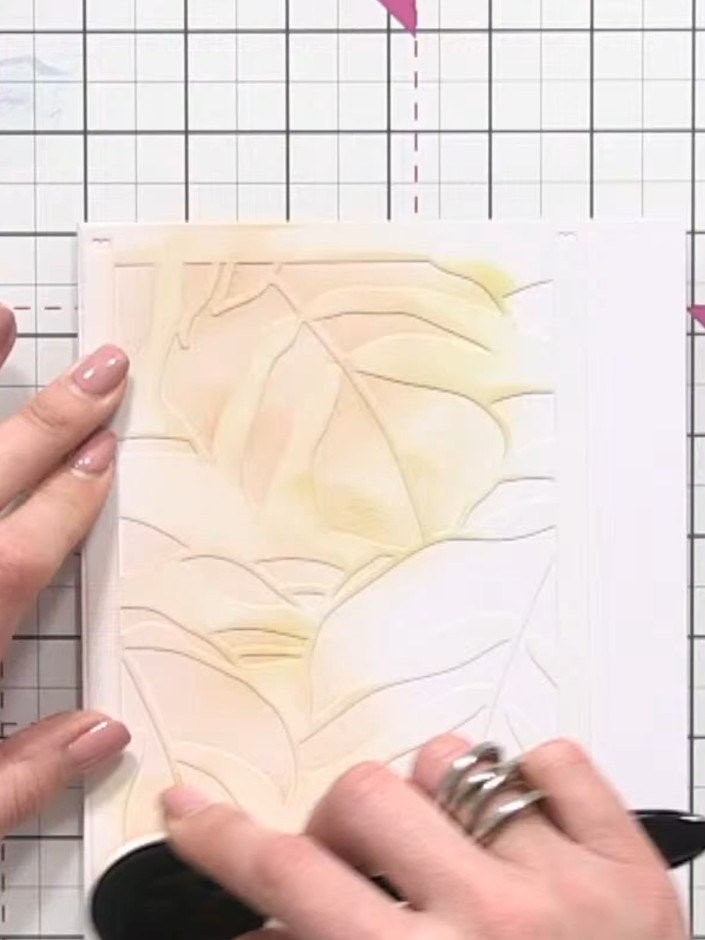 Step 3: Position the second stencil over your card and apply the same yellow ink with the blending sponge, pressing sl
