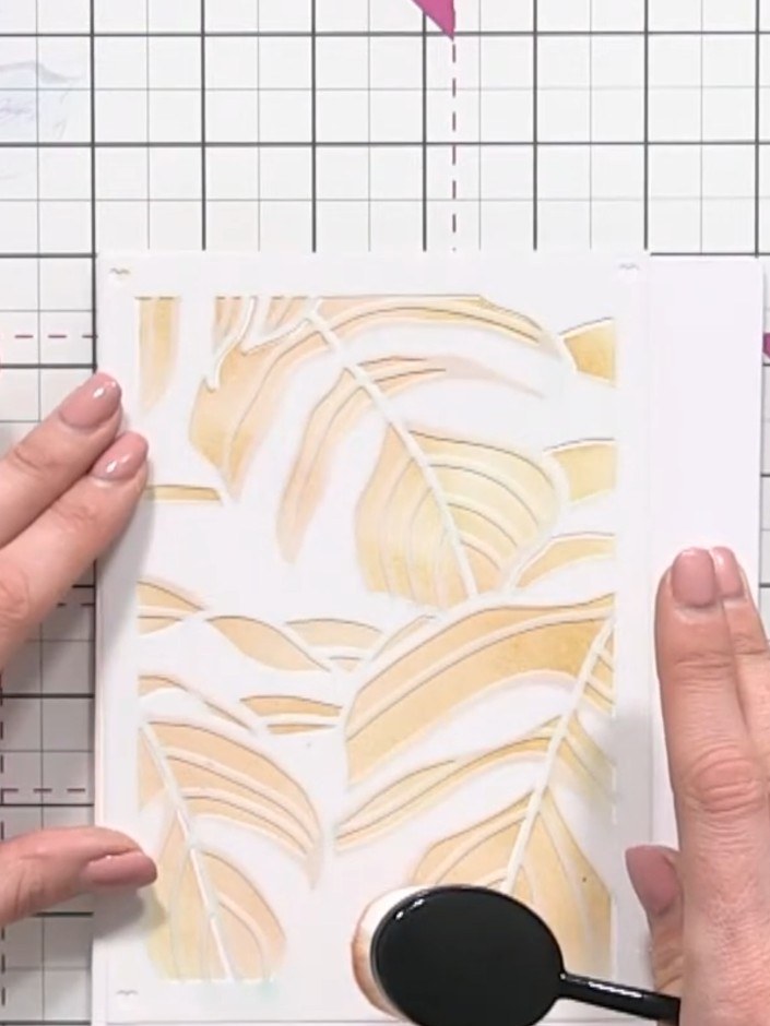 Step 4: Position stencil number three over your card and apply ink using the blending tool with increased pressure. Th