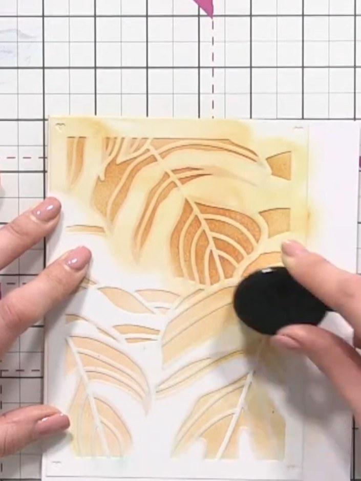 Step 5: Place stencil number four over your card and hold it firmly in position with one hand. Using the blending brus