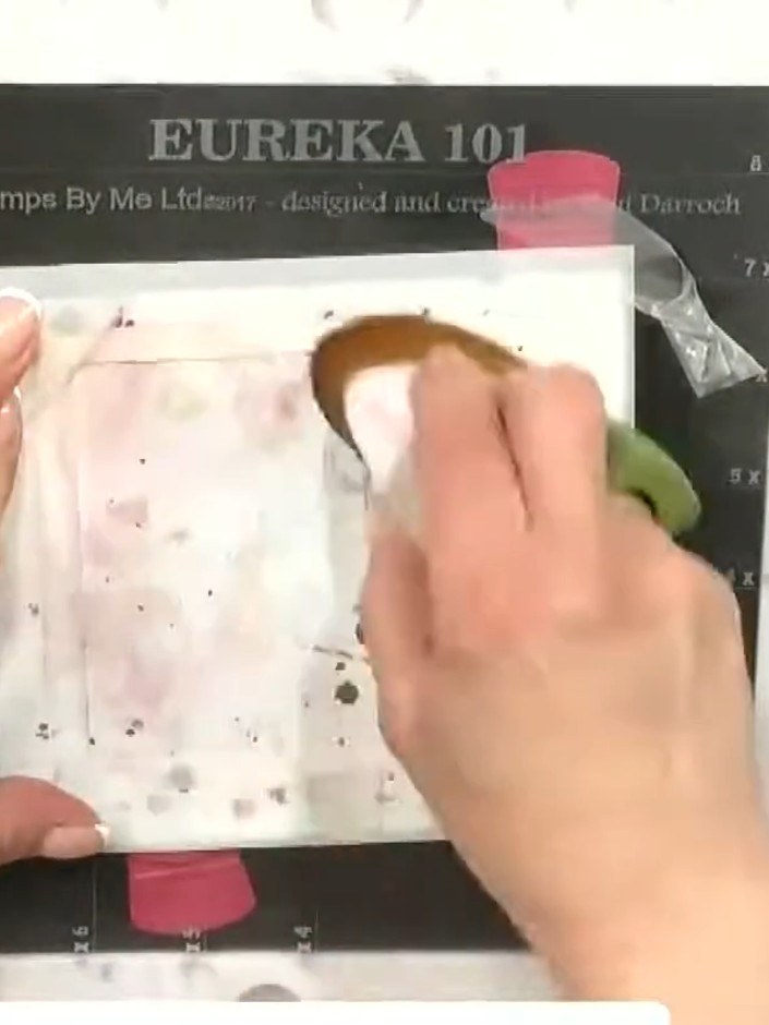 Step 2: Position the taped stencils on your card base and secure with low-tack tape. Ensure the stencils are placed wh
